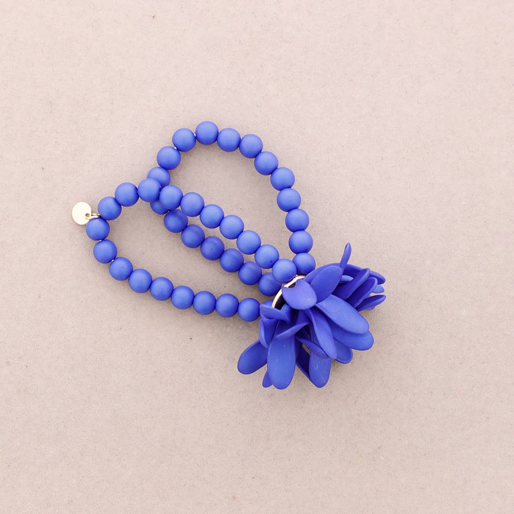 PULSERA ELÁSTICA BOLITAS FLOR RESINA